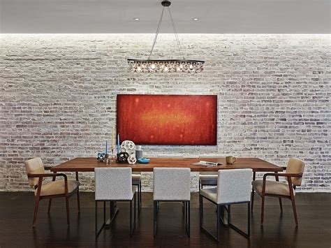 The fireplace is open to both the living and the dining room. 50 Bold and Inventive Dining Rooms with Brick Walls