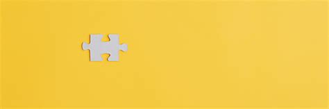 One Blank Puzzle Piece Place On Yellow Background Stock Photo