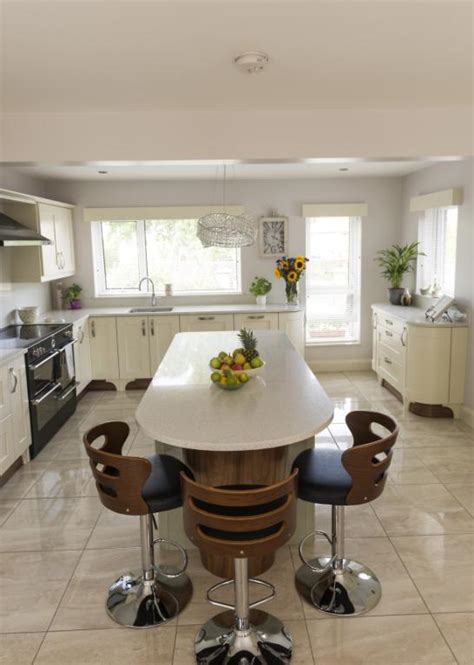 What are the main options for kitchen island? Kitchens Newry - Ivory Shaker Kitchen With Sage Green Island
