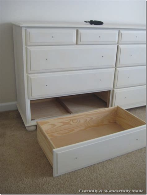 Brace yourself when lifting the drawer out. DIY Drawer Stop: Fix Falling Drawers - Made by Carli