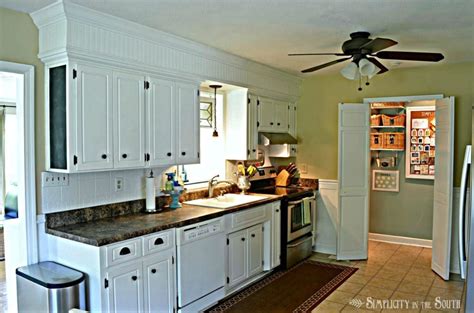 The kitchen soffit or the above kitchen cabinet area is a huge waste of space. I'm Back With a Final Home Tour and Exciting News! | Kitchen soffit, Above kitchen cabinets ...