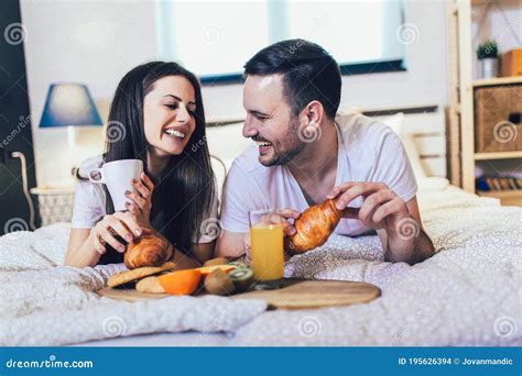 Couple Having Breakfast In Bed In The Bedroom Stock Photo Image Of