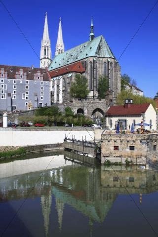 Neisse river bank with St Peters church and Weidhaus in the back, V...