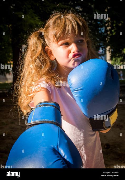 Little Girl Wearing Blue Boxing Gloves Stock Photo Alamy