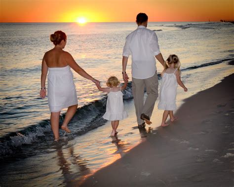 A Family Stroll On The Beach To Watch The Sunset Photography Company Beach Photography