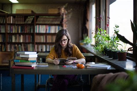 Woman Studying At The Library Del Colaborador De Stocksy Lumina Stocksy