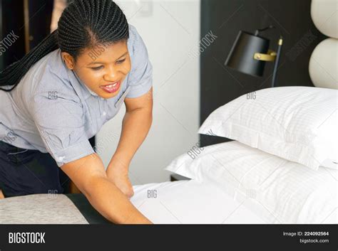 maid making bed hotel image and photo free trial bigstock