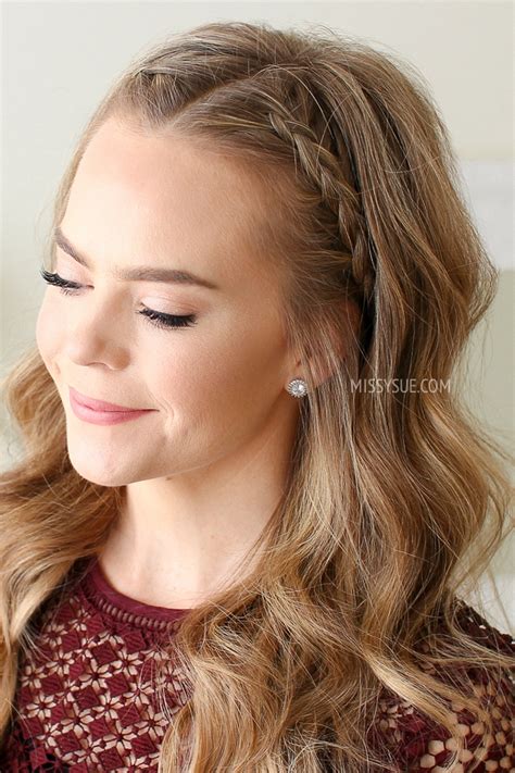 This hairstyle incorporates two thin braids, on either side of the head, which are then brought up over the head and then the sparkly plastic headbands are placed in to accent the braids to your liking. Dutch Braided Headband | MISSY SUE
