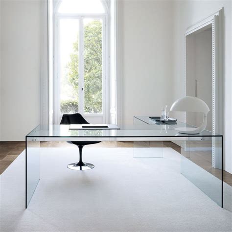 An Image Of A Glass Table In The Middle Of A Room With White Walls And