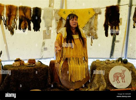 A Native American Micmac Woman Speaking In A Wigwam With Traditional