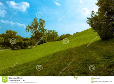 Rolling Green Hill Under Blue Sky Stock Photo Image Of Green Grass