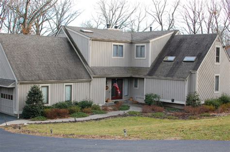 This is a row house that was inspired by houses from japan that were built primarily in the 1980s. 1980s contempo house needs new siding and maybe a small ...