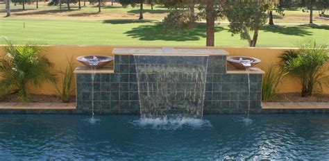 Water features come in many forms, and thus have varying price tags. http://www.redoyourpool.com/wp-content/uploads//2009/01 ...