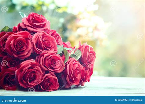 Close Up Beautiful Red Roses Bouquet With Glowing Light Background For