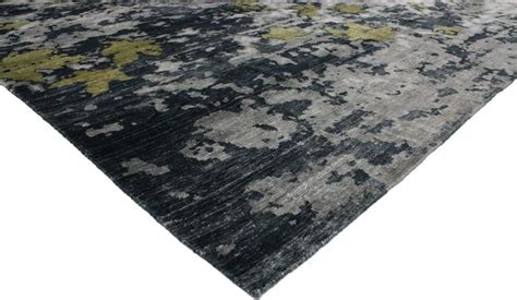 The most common navy blue gold rug material is wool. Navy Blue and Gray Modern Area Rug with Contemporary Abstract Style at 1stdibs