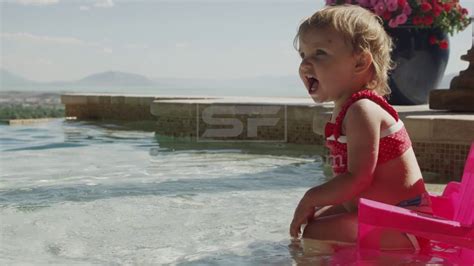 Close Up Of Baby Girl Splashing In Swimming Pool Youtube