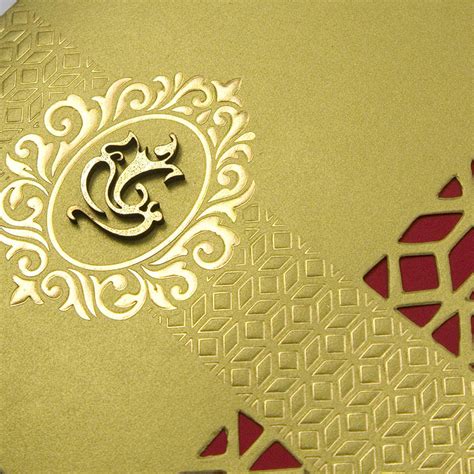 ganesha themed golden laser cut tri fold indian wedding card