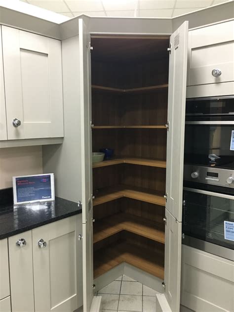 These corner diagonal cabinets maximize storage space with open cubbies for a microwave, small tv and cookbooks. howdens corner larder unit - Google Search | Simple ...