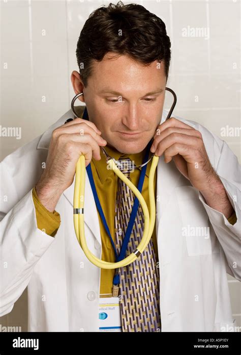 Medical Professional Prepares Stethoscope As An Exam Is About To Begin