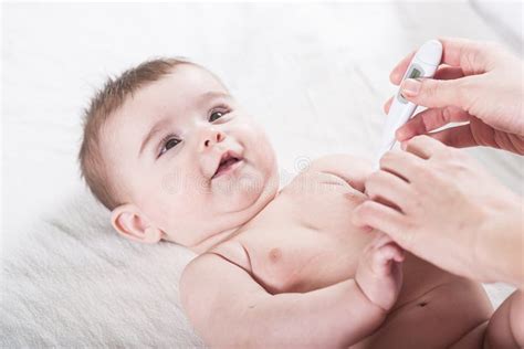 Doctor Measures The Temperature Of Little Baby Stock Photo Image Of
