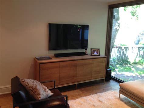 Maybe you would like to learn more about one of these? SONOS Playbar sitting on media cabinet with 55" Samsung TV ...
