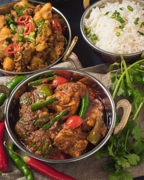 In thailand, fried rice along with basil chicken (or other variations), are dishes that nearly every stir fry restaurant serves, especially common at street food stalls. top view of Indian restaurant chicken jalfrezi with rice and aloo keema | Curry ingredients ...