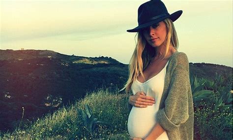 Leah Jenner Cradles Baby Bump While Cliffside In New Instagram Snap