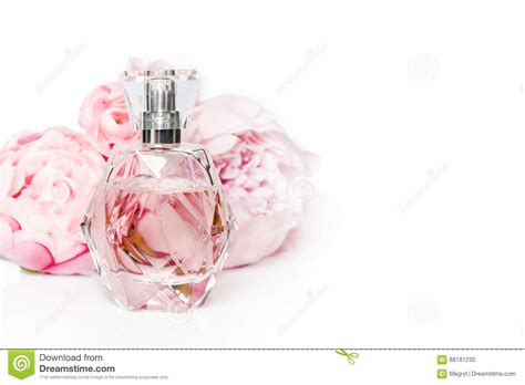 Pink Perfume Bottle with Flowers on Light Background. Perfumery