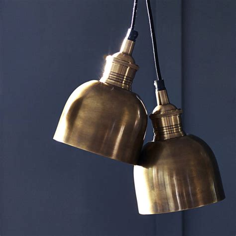 For exterior kitchens and dining areas, mini pendants can be a great option. flori brass pendant light by rowen & wren | notonthehighstreet.com