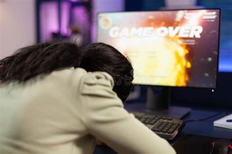 Sad Loser Gamer Person Playing Space Shooter Video Games Stock Photo