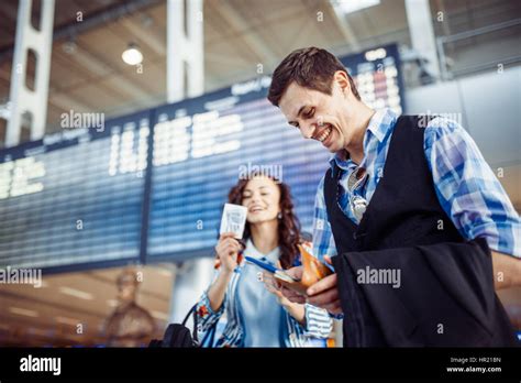 Welcoming embrace. Young loving couple hugging in the airport terminal