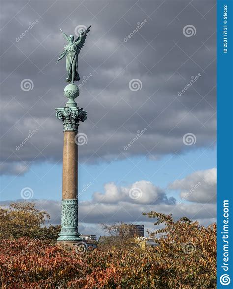 Bronze Angel Sculpture On The Ivar Huitfeldt Column Among Autumn Leaves