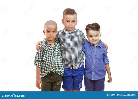 Three Fashion Cute Boys Are Standing Together On White Isolated