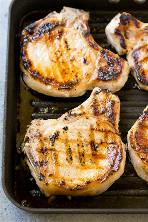 These pork chops are marinated to make them extra flavorful and tender. BBQ Pork Chops - Dinner at the Zoo