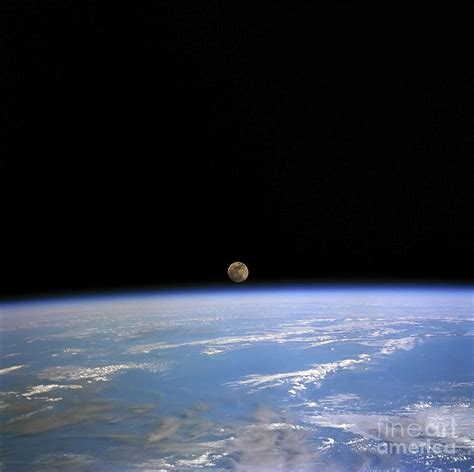 The Moon Above Earths Horizon Photograph By Stocktrek Images Pixels
