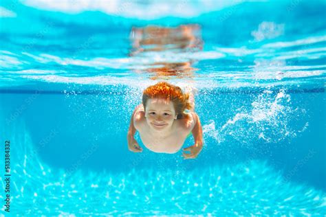 Child Underwater Swim In The Swimming Pool Cute Kid Boy Swimming In