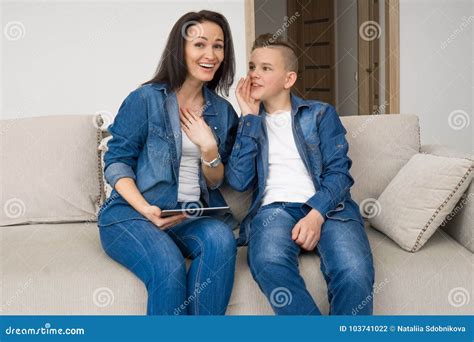 Portrait Of Mother And Her Son On Sofa At Home Stock Photo Image Of