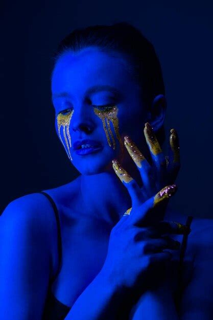 Premium Photo Fashion Portrait A Girl With Fluorescent Paint On Her