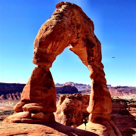 Doing Yoga Inside Delicate Arch In Moab Utah Vacation Activities