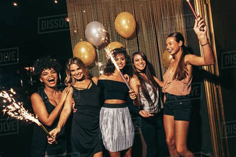 Group Of Women With Fireworks At Party Stylish Girls Enjoying Party At