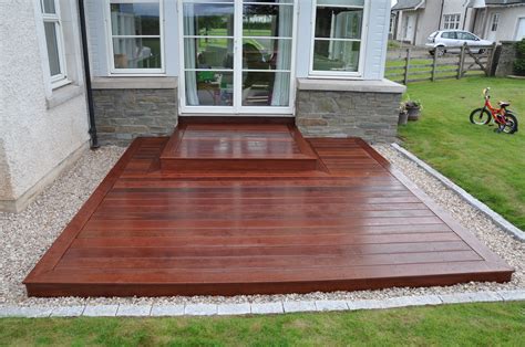 A Simple Square Deck Provides A Practical Entrance And An Additional
