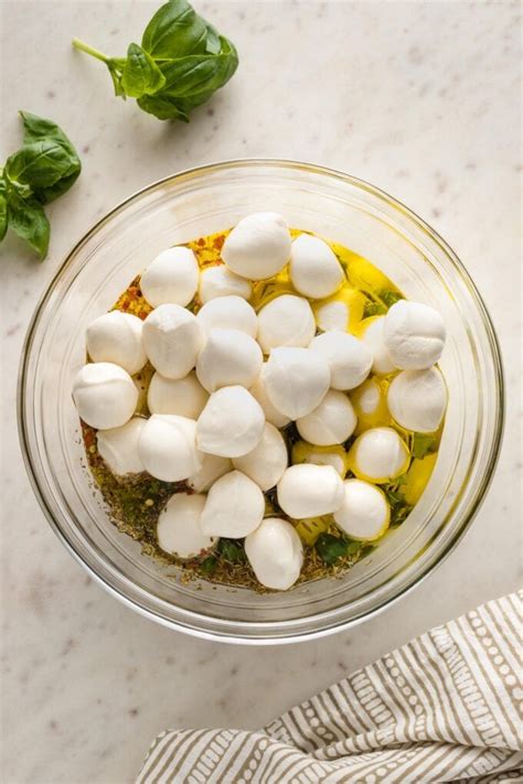 Marinated Mozzarella Balls With Tomato And Avocado Nourish And Fete