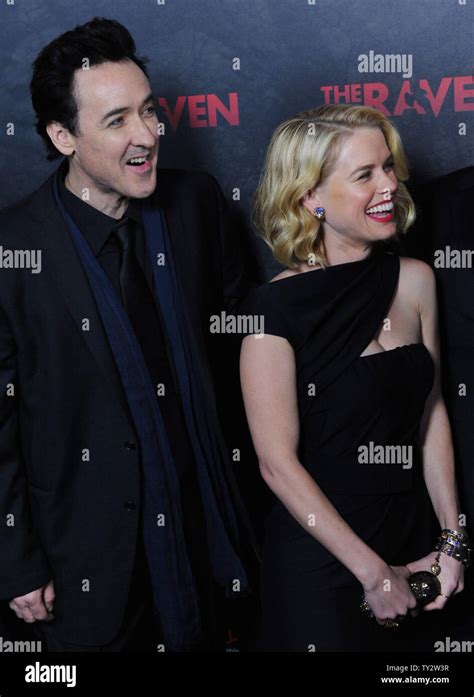 Actor John Cusack L And Alice Eve Cast Members In The Motion Picture