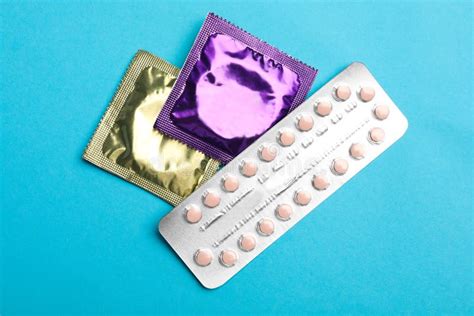 condoms and birth control pills on pink background safe sex stock image image of infection