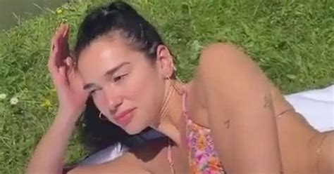 Dua Lipa Sends Fans Wild As She Strips Down To Floral Bikini For A Swim