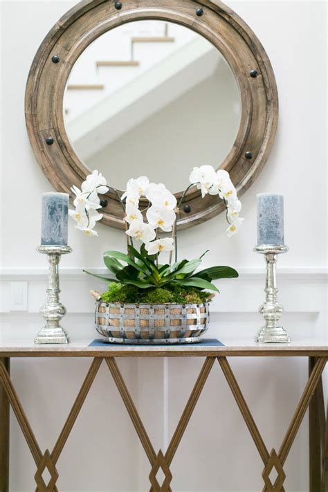 Strategically Balance Your Foyer Decor With A Classical Wooden Porthole