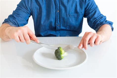 Sad And Hungry Man Watching Poor Diet Meal Stock Photo Image Of