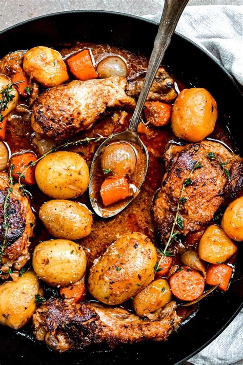 The sauce is usually formed from a light tomato base and accented with onion, salt and pepper, and that essential mchuzi mix! chicken stew with potatoes in skillet