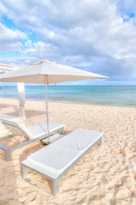 Lounge Chair Beds And Umbrella At White Sandy Beach In Caribbean Stock Photo Image Of People
