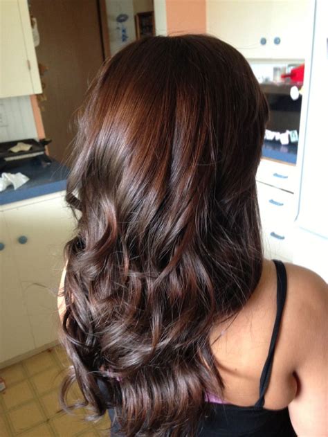 This chocolate brown style is one that has the red hues in it. Long layers & dark brown with red tint | Hair | Pinterest